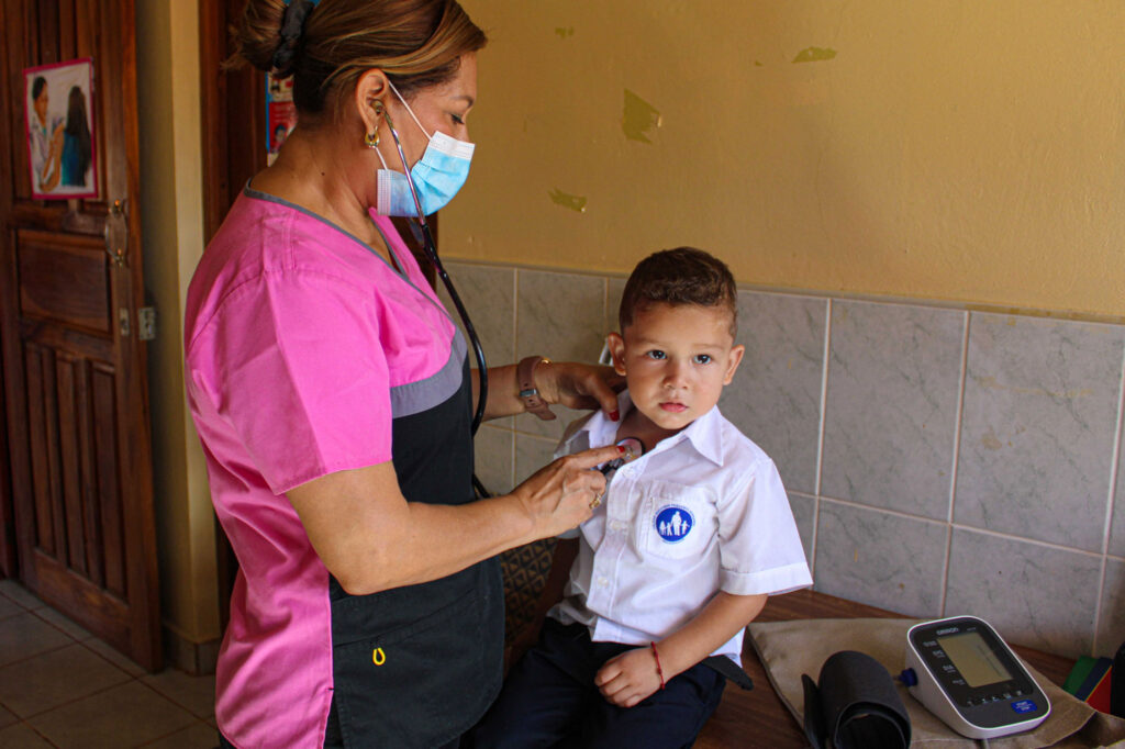 Child receiving health check